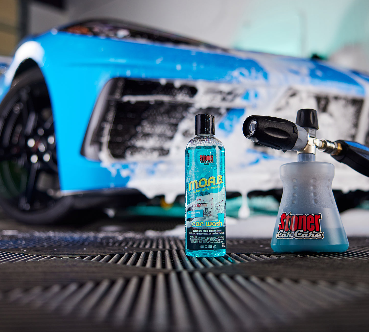 
                  
                    A photo of the Stoner Extreme Mega Foam Cannon Kit MTM Hydro PF22.2 posed in front of a car, with the moab bottle and the foam cannon
                  
                